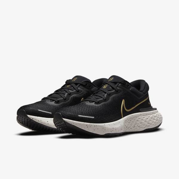 Nike ZoomX Invincible Run Flyknit Straßen Laufschuhe Herren Schwarz Metal Gold | NK523LWO